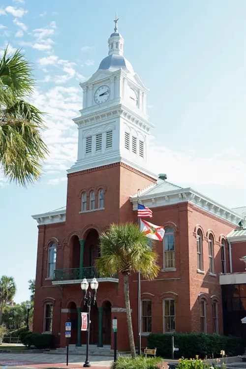 Historic red-brick courthouse with a white clock tower